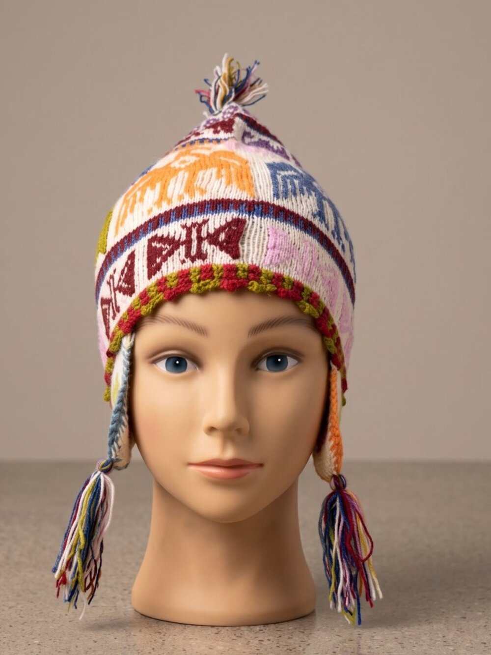 Hand-knitted alpaca wool chullo with Andean condor design.